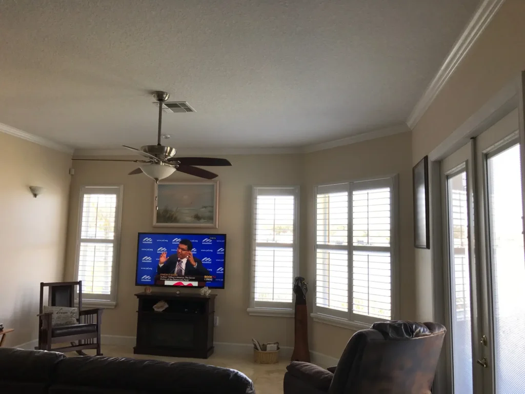 atlantic wood painted shutters in a living room