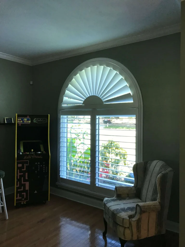 custom window treatment with an arched window